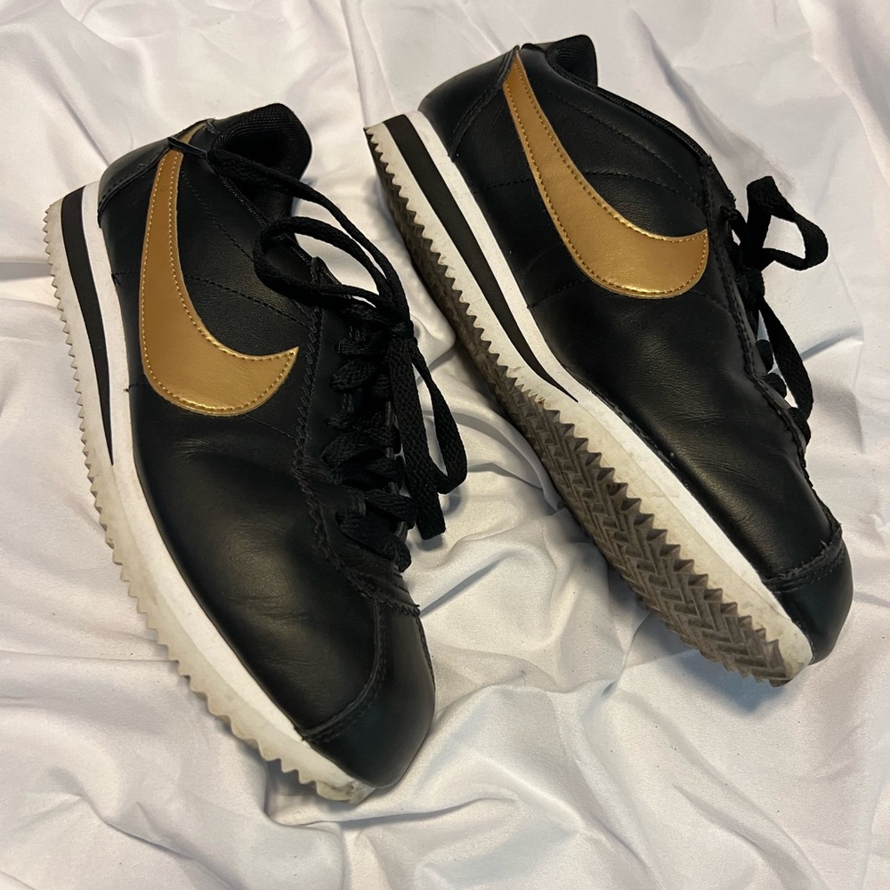 Nike Women's Black Sneakers with Gold Swoosh